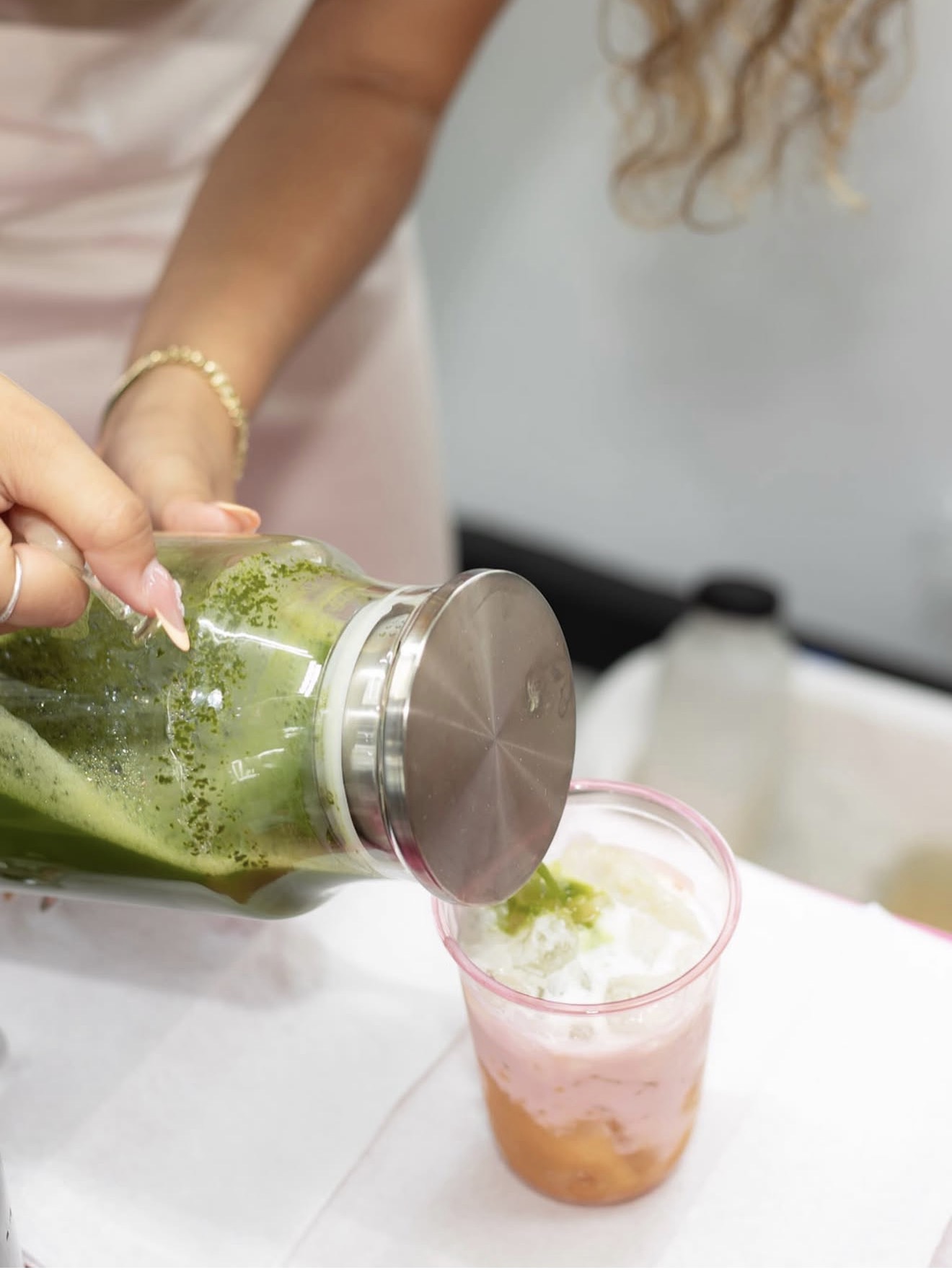 Fresh matcha poured over a fruit drink at Casa Sol