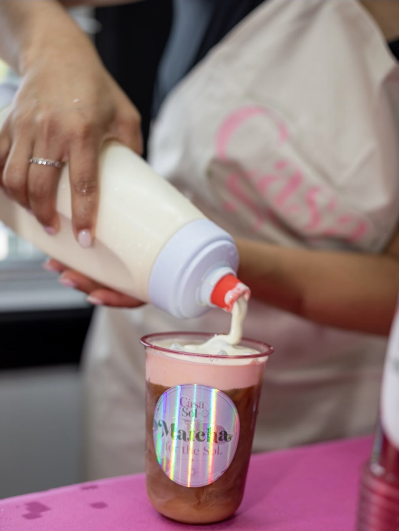Cold foam poured by hand over a Casa Sol drink
